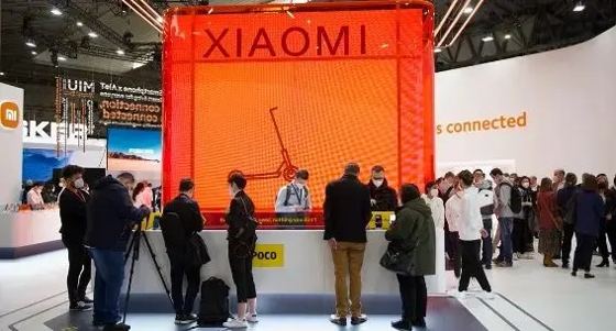 XIAOMI (red cube), POCO, Mi logo, MIUI, 'connected' wall text booth — MWC 2022 Barcelona