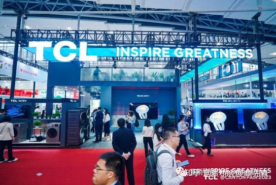 TCL, INSPIRE GREATNESS (overhead LED fascia), TCL WASH, TCL Mini LED TV; neighbours 广州工控 GIHK, Wanbao 万宝; credit strip TCL @CANTON FAIR 2023 booth — TCL @CANTON FAIR 2023
