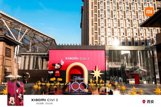 xiaomi CIVI 3 (backdrop header), Disney 100 (3D letters), Disney (Mickey plinth); MI logo + 'Xiaomi CIVI 3' + '西安' as overlay frame booth — Disney 100 (printed on set); 小米奇妙夜 Xiaomi Civi 3 launch, Xi'an G-park, 2023-06-08 (ctx)