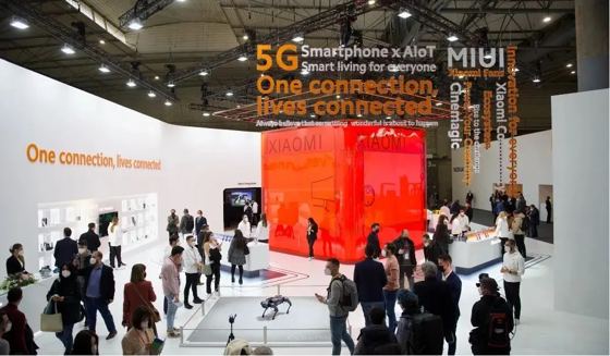XIAOMI (red translucent cube), MIUI, One connection lives connected, NOKIA (neighbouring stand, distant) booth — MWC 2022 Barcelona